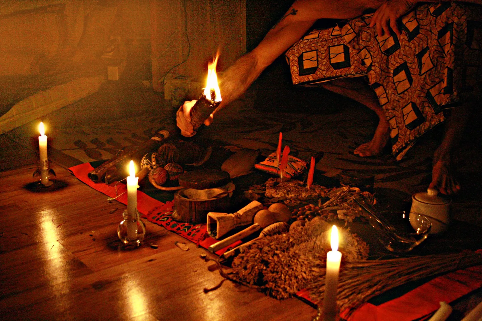 Candles and ceremonial objects laid out on the altar before a ceremony