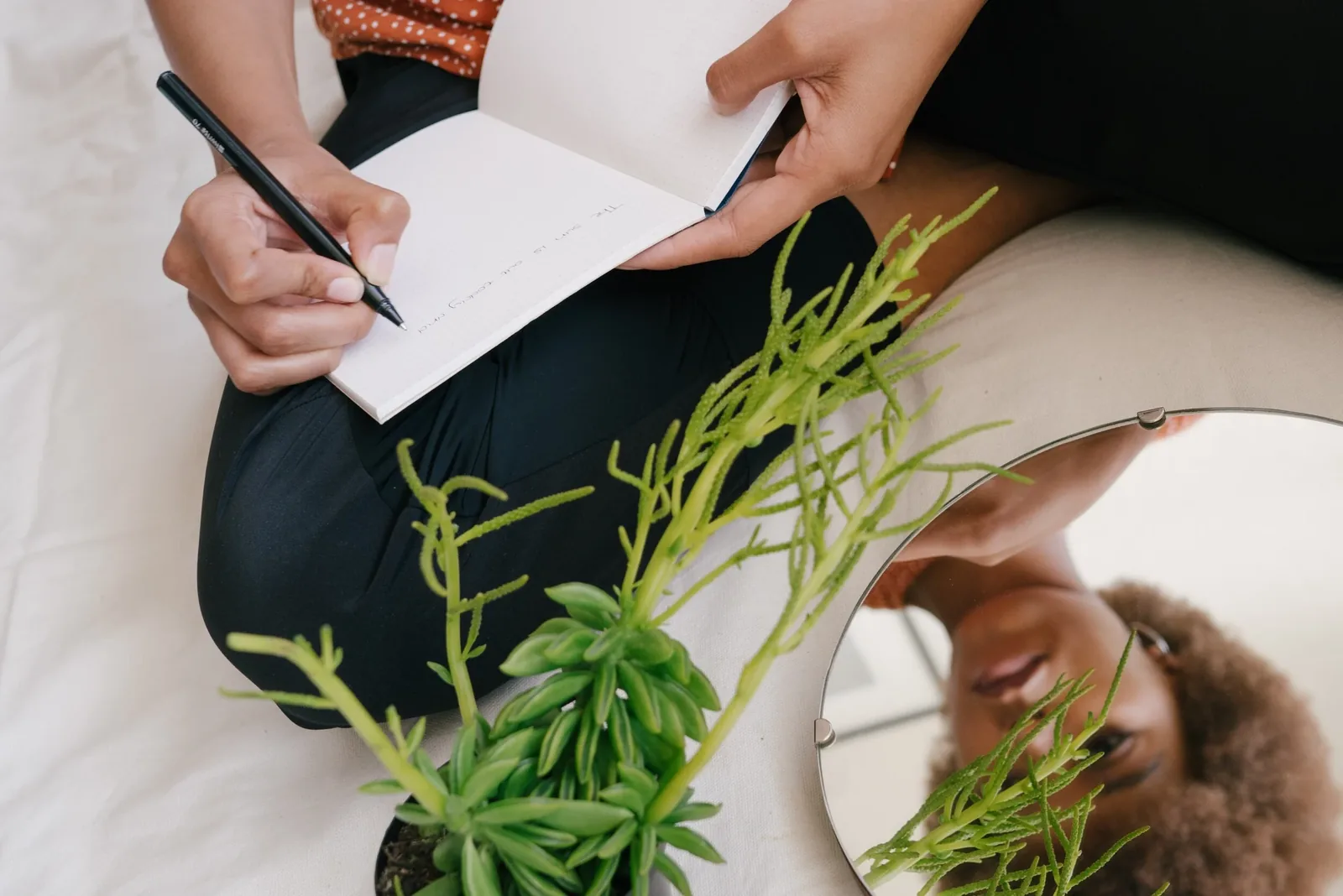 A guest writing questions in a notebook