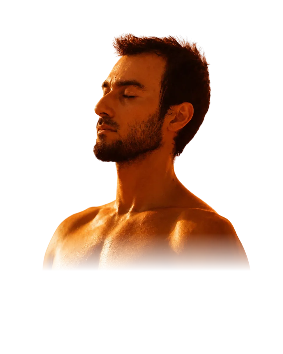 A retreat participant in profile, eyes closed, photographed in warm light